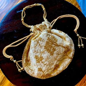 Golden silk clutch with embroidery and beads